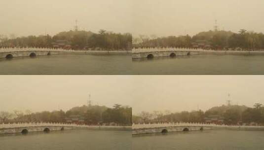 北京沙尘暴下的北海公园高清在线视频素材下载