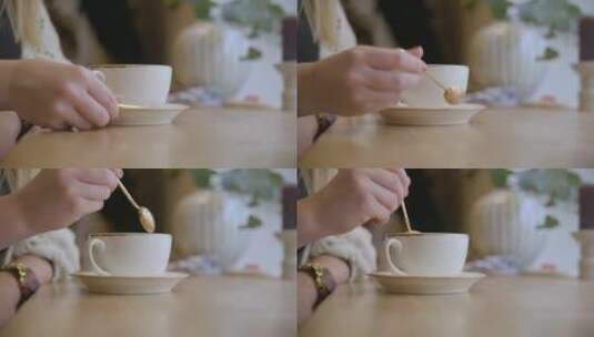 手拿金茶匙搅拌咖啡高清在线视频素材下载