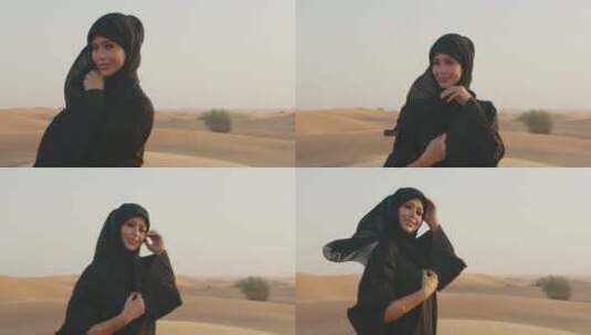 走在多风的沙漠里的女人高清在线视频素材下载