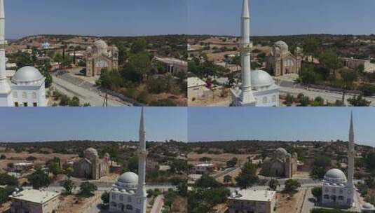 用无人机鸟瞰教堂和清真寺。不同宗教的礼拜场所并排。高清在线视频素材下载