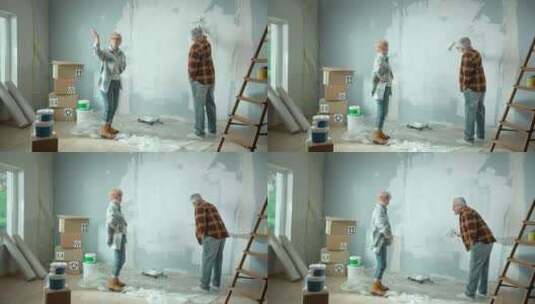 老人用油漆滚筒用白色油漆粉刷墙壁高清在线视频素材下载