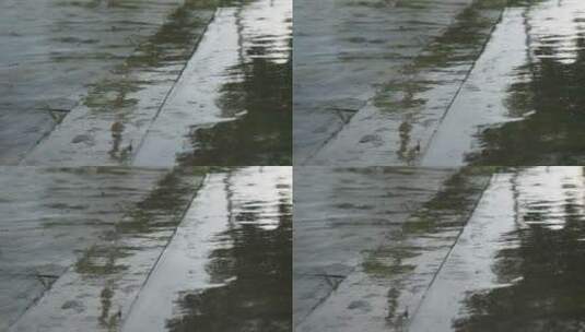 阴天下雨水滴水泥地马路升格高清在线视频素材下载