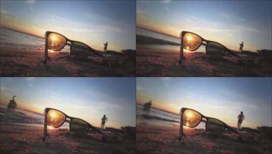 人文艺术黄昏阳光眼镜沙滩海浪有人在走路高清在线视频素材下载