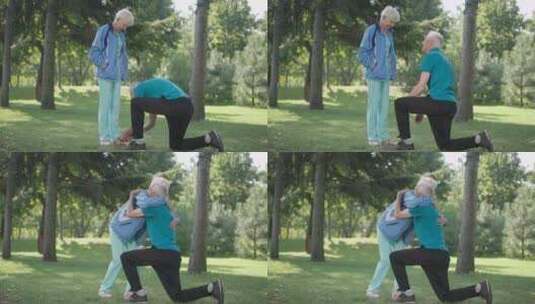 感恩的老年妻子拥抱丈夫在春夏公园的运动鞋高清在线视频素材下载