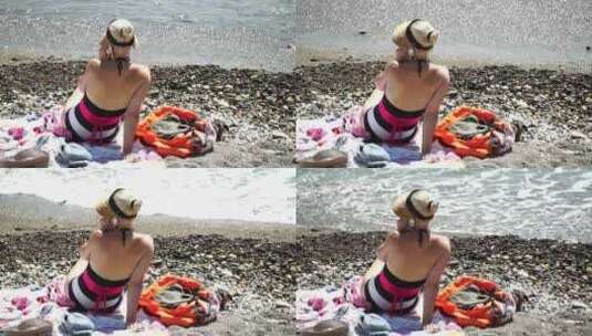 女人在海滩上在日落在夏季假期假期慢动作特高清在线视频素材下载