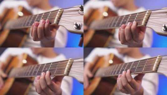 儿童手指在不同品上捏吉他弦的特写高清在线视频素材下载