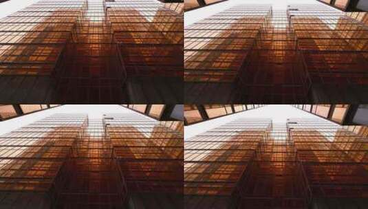 4K-黄昏染黄后的现代化摩天大楼高清在线视频素材下载