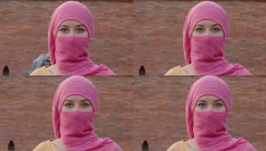女人，穆斯林，看着相机，粉色高清在线视频素材下载