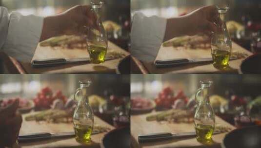 厨师把橄榄油放在桌子上高清在线视频素材下载