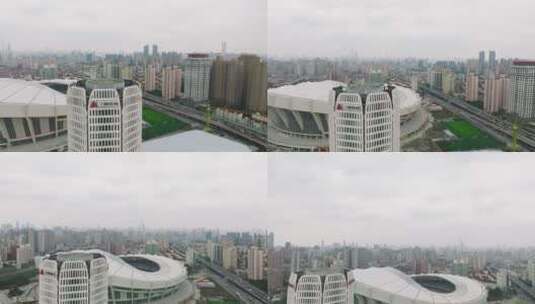 4K航拍上海体育场高楼大厦带出上海全景高清在线视频素材下载