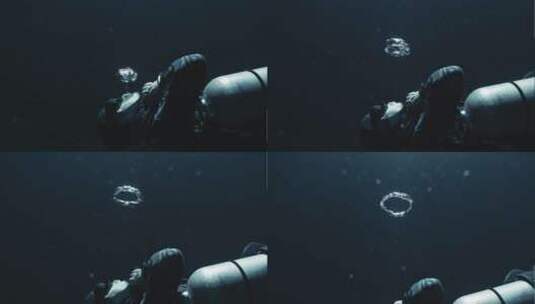 潜水员在水底吐圆圈高清在线视频素材下载