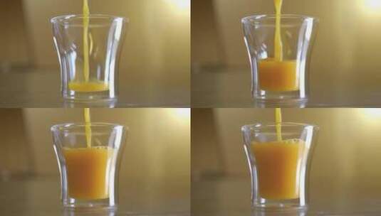 正在倒橙汁，慢动作高清在线视频素材下载