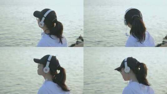 女孩在江边戴着耳机听歌4k视频素材高清在线视频素材下载