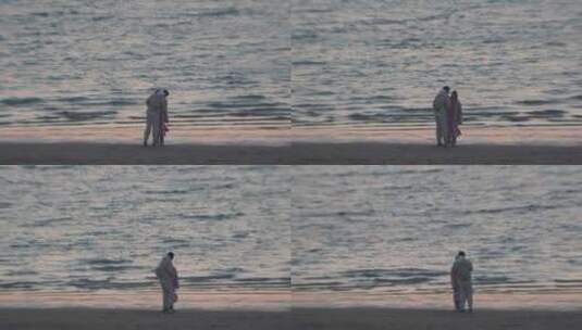 威海小石岛西海岸沙滩上的情侣高清在线视频素材下载