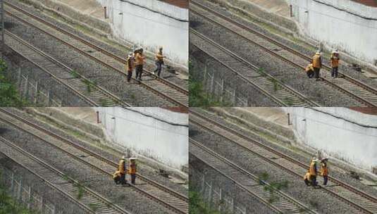 交通行业铁路轨道上工作的养路工人高清在线视频素材下载