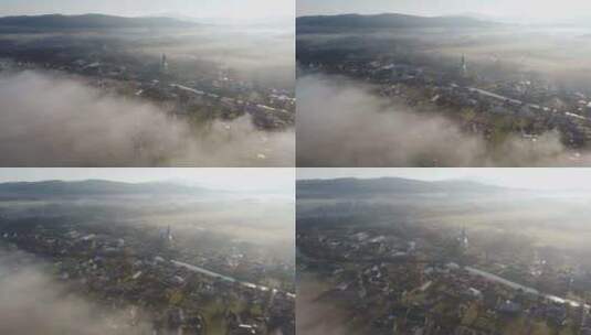 航拍雾中的村庄高清在线视频素材下载