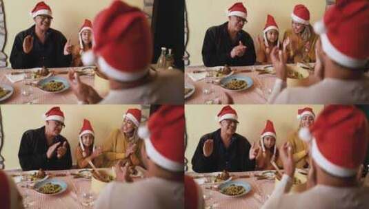 快乐的拉丁家庭庆祝圣诞节，一起在家吃饭高清在线视频素材下载