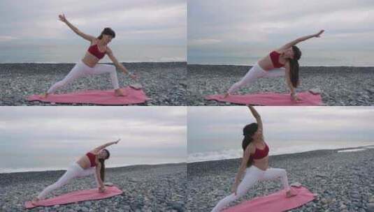 女士在圆石滩的海边做瑜伽运动高清在线视频素材下载