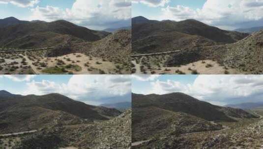 空中：加利福尼亚州圣地亚哥沙漠景观中间的一条路。高清在线视频素材下载