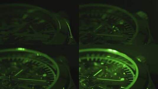 绿光照射中的手表指针转动高清在线视频素材下载
