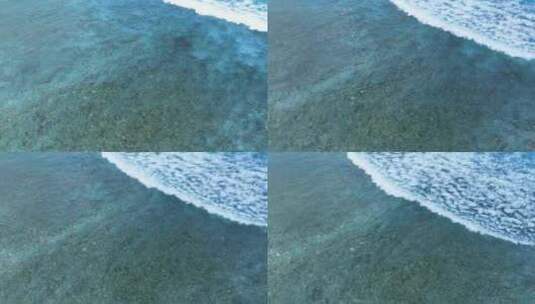 航拍下巴厘岛清澈的海水与海浪高清在线视频素材下载