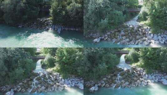俯视小溪水汇入河流高清在线视频素材下载