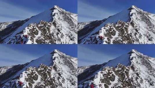 航拍攀登雪宝顶雪山的登山者翻越骆驼背高清在线视频素材下载