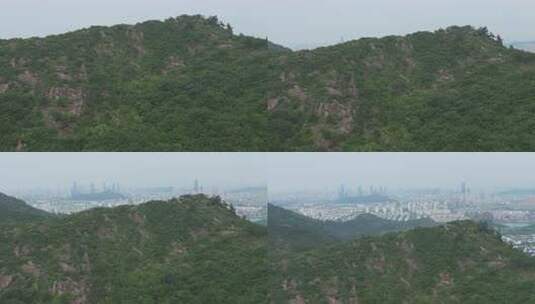 城市背景下的葱郁山林风景/苏州/天池山高清在线视频素材下载