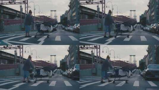 一个乞丐拖着他的行李走在街边高清在线视频素材下载