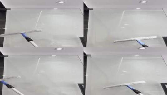 保洁员擦办公室隔墙玻璃高清在线视频素材下载