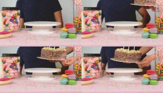 生日蛋糕在生日男孩面前放蜡烛高清在线视频素材下载