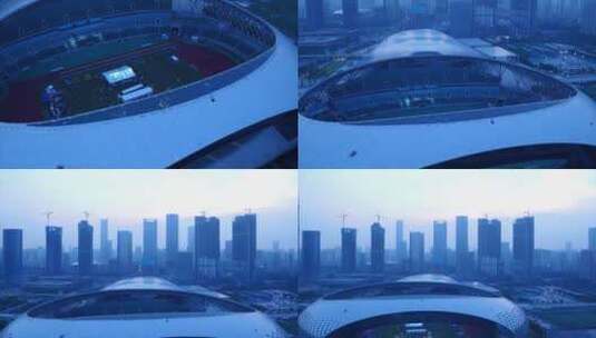 航拍从深圳湾体育场内拉出建筑群 中景高清在线视频素材下载
