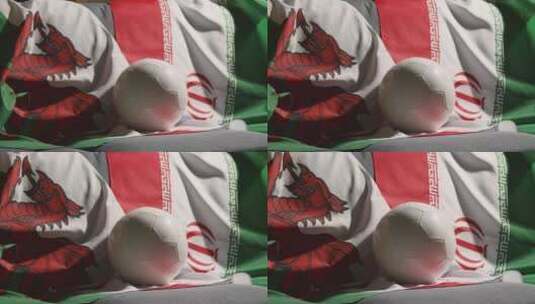 威尔士和伊朗国旗前的足球高清在线视频素材下载