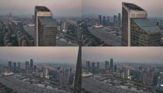 航拍落日夜幕下的南京地标双子塔建筑高清在线视频素材下载