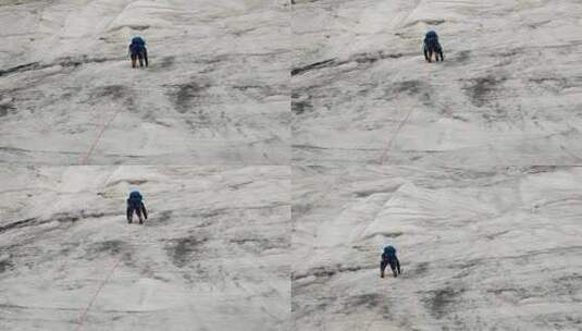 冰川上攀登甘孜党龄主峰夏羌拉雪山的登山者高清在线视频素材下载