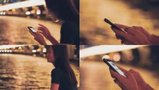 女孩夜晚在江边玩手机4k视频素材高清在线视频素材下载