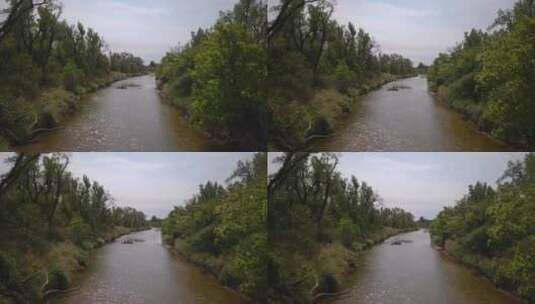 艾瑞拉无人机拍摄的萨灵号船在河与乘客之间的丛林中穿梭。高清在线视频素材下载