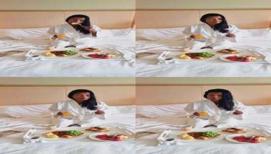 在床上吃早餐的女人高清在线视频素材下载