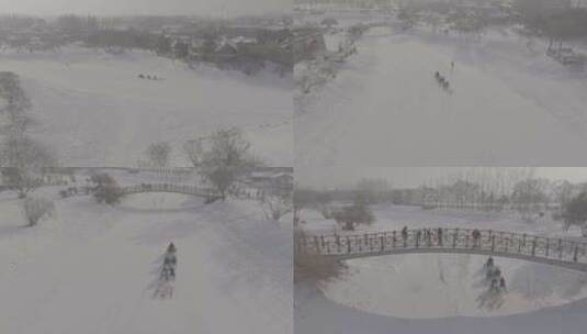 哈尔滨伏特加庄园游客做雪车游玩雪景航拍高清在线视频素材下载