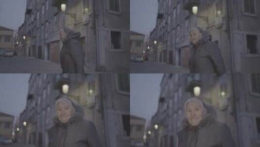 夜间城市街道上的老年妇女高清在线视频素材下载