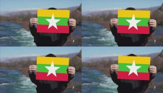 手持缅甸国旗的人高清在线视频素材下载