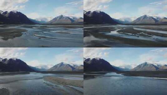 编织的冰川河流流经宽阔的山谷和新西兰的岩高清在线视频素材下载