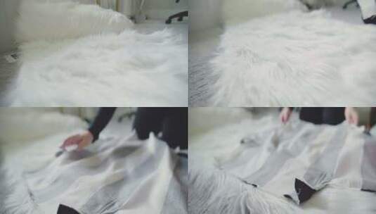 当女人准备测量时，毛茸茸的白色织物卷在奶高清在线视频素材下载