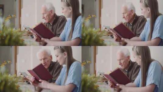 在室内看书的老人旁边看书的女人高清在线视频素材下载