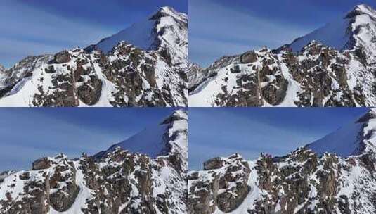 航拍攀登雪宝顶雪山的登山者翻越骆驼背高清在线视频素材下载