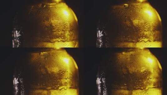 冰镇啤酒瓶表面的水珠特写高清在线视频素材下载