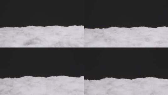 在黑色背景上的人工雪高清在线视频素材下载