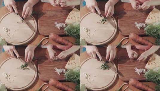 在砧板上切菜和剥蒜的特写高清在线视频素材下载