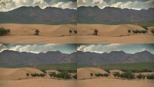 沙漠、草地、山脉和蒙古包营地的结合高清在线视频素材下载
