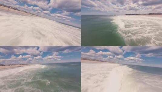 FPV穿越机无人机航拍海浪冲击沙滩蓝天白云高清在线视频素材下载